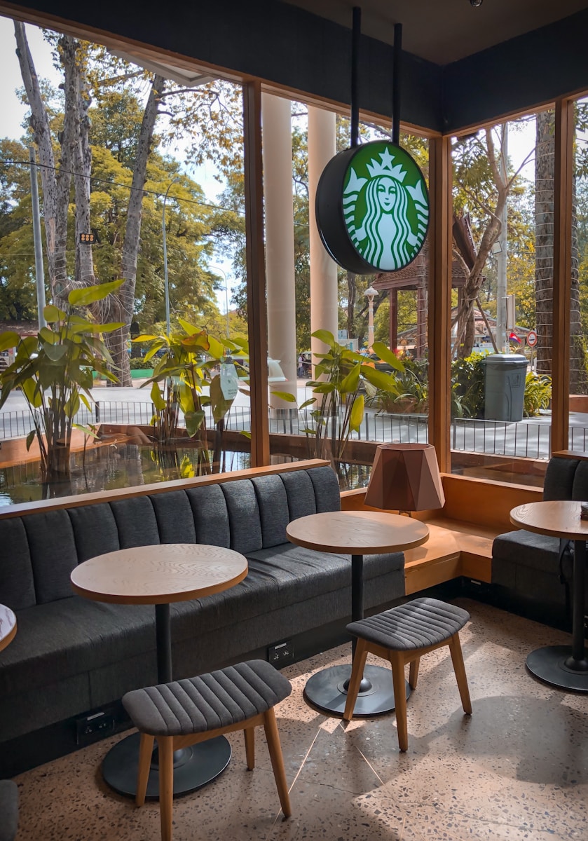 Wi-Fi Nomad Magic: 3 Tools That Make Starbucks Your 24/7 Income Engine round brown wooden table